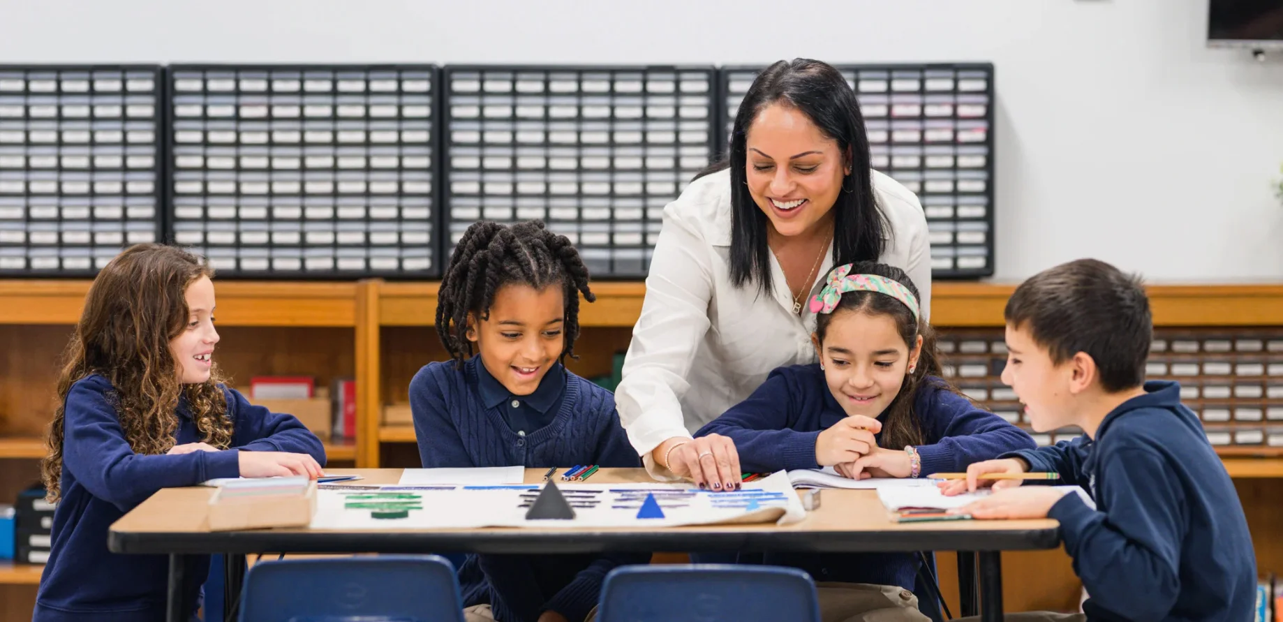 A montessori accredited teacher and students at a montessori elementary school in Danbury