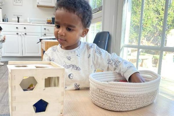 baby playing at their infant childcare in danbury