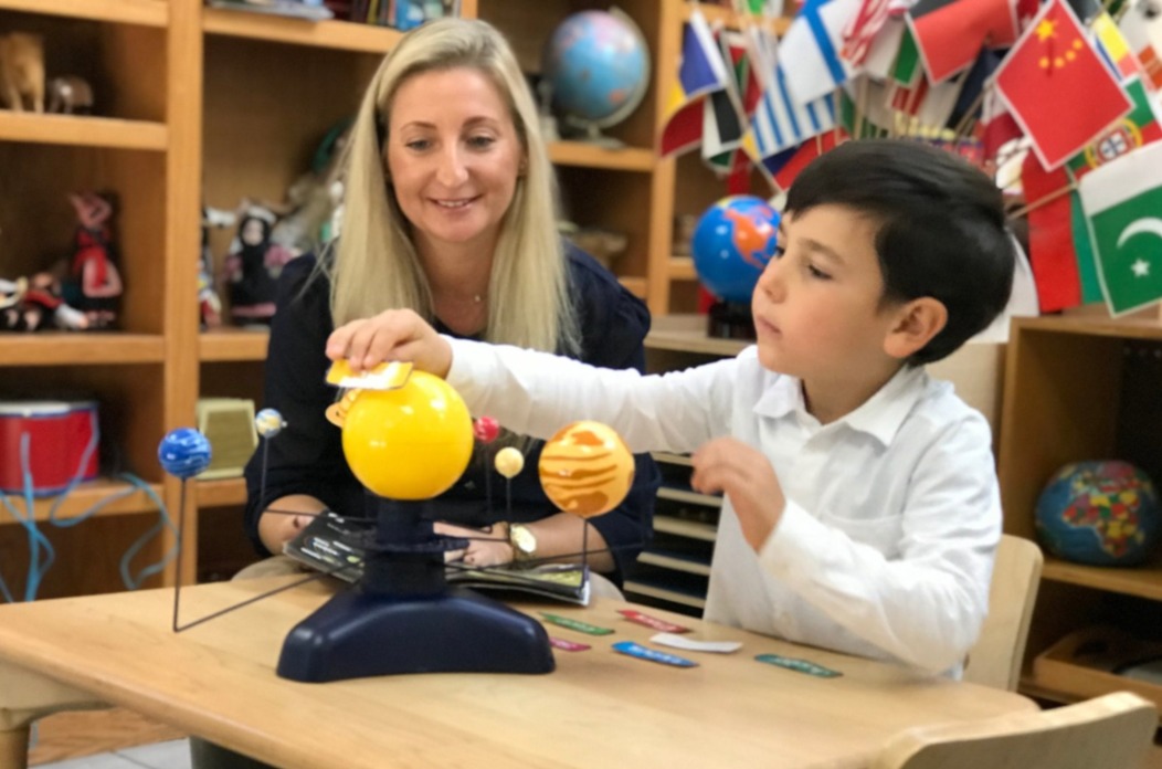 teacher and student in montessori school